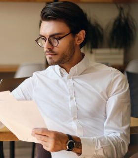 young-serious-businessman-in-eyeglasses-thoughtful-WU7QCKG.png